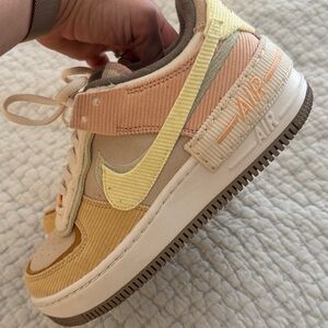 Nike Air Sneakers with Yellow and Orange Accents
